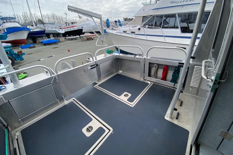 Apollo Axon Yacht Photos Pics 2007 Armstrong Marine Catamaran deck, featuring spacious layout and storage compartments.