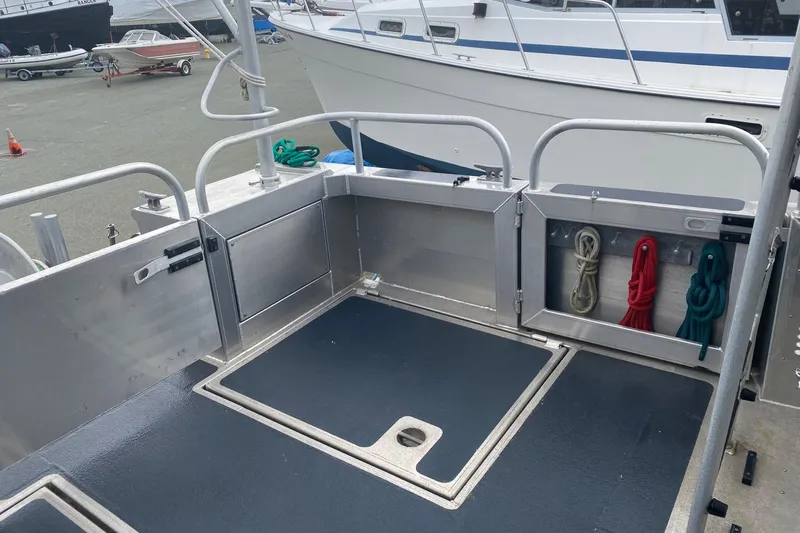 Apollo Axon Yacht Photos Pics 2007 Armstrong Marine Catamaran deck with storage compartments and mooring ropes.