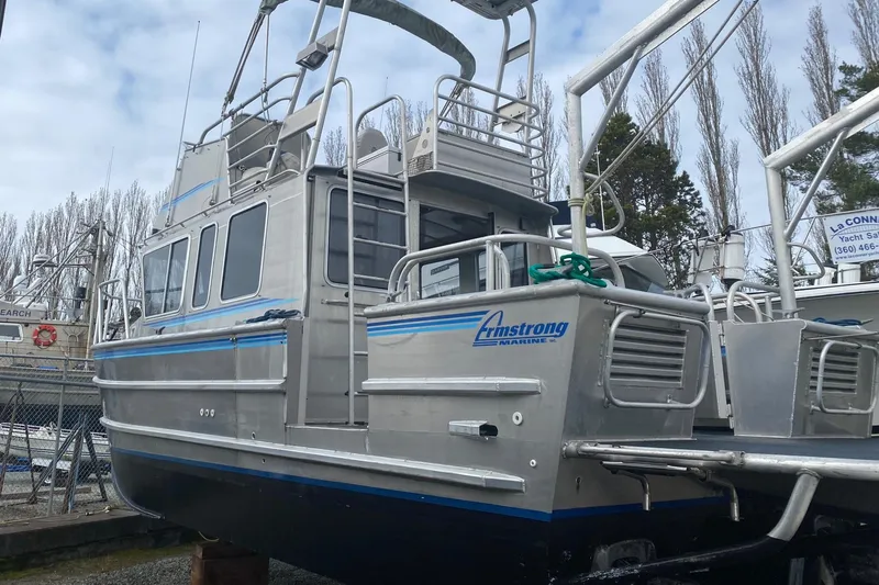 Apollo Axon Yacht Photos Pics 2007 Armstrong Marine Catamaran with aluminum hull, docked in a marina.
