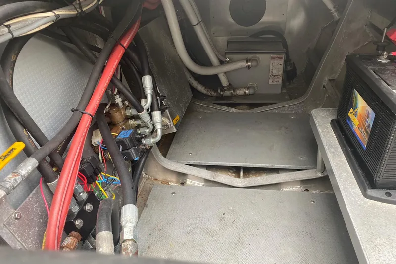 Apollo Axon Yacht Photos Pics Engine compartment of a 2007 Armstrong Marine Catamaran, showing wiring and battery setup.