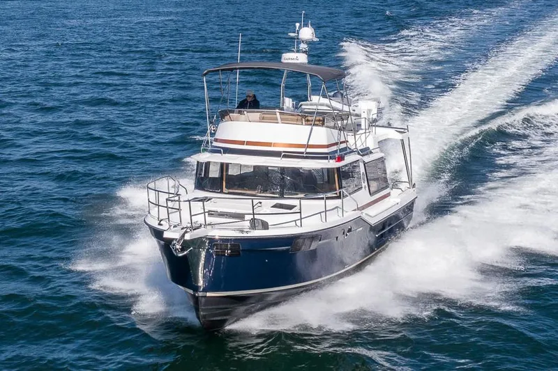  Yacht Photos Pics Manufacturer Provided Image: 2025 Ranger Tugs R-43 CB cruising on open water, showcasing sleek design and performance.
