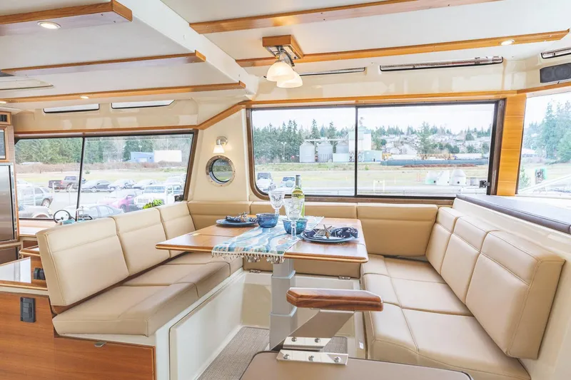  Yacht Photos Pics Manufacturer Provided Image: Luxurious interior of 2025 Ranger Tugs R-43 CB with elegant dining area.