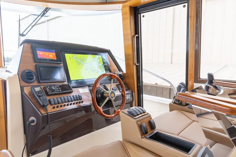  Yacht Photos Pics Manufacturer Provided Image: Interior helm of 2025 Ranger Tugs R-43 CB with navigation screens and controls.