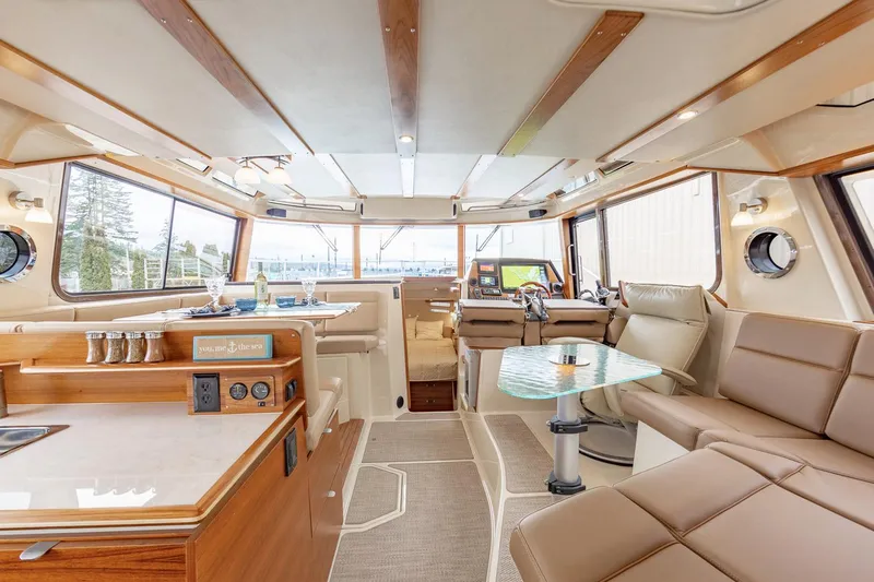  Yacht Photos Pics Manufacturer Provided Image: Luxurious interior of 2025 Ranger Tugs R-43 CB yacht with modern amenities and seating.