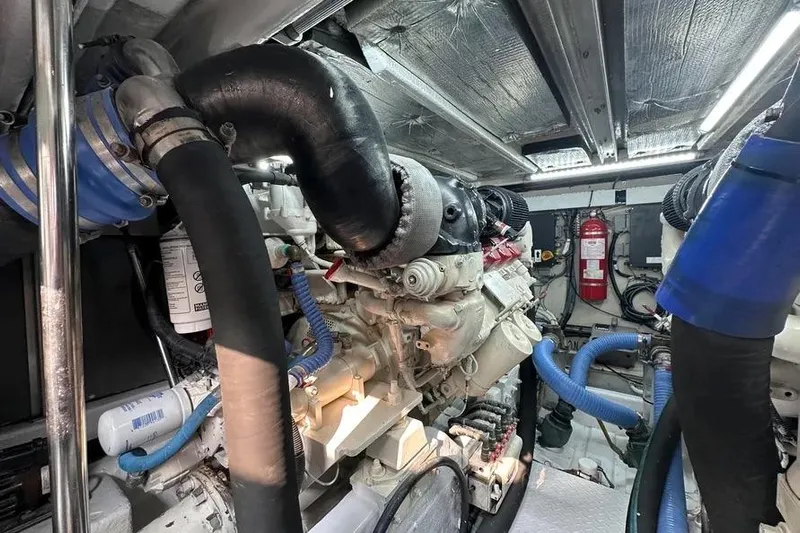  Yacht Photos Pics Engine room of 2006 Sea Ray 580 Sedan Bridge with visible hoses and equipment.