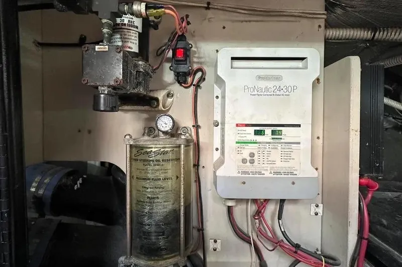  Yacht Photos Pics Engine room of 2006 Sea Ray 580 Sedan Bridge with ProNautic charger and steering oil reservoir.