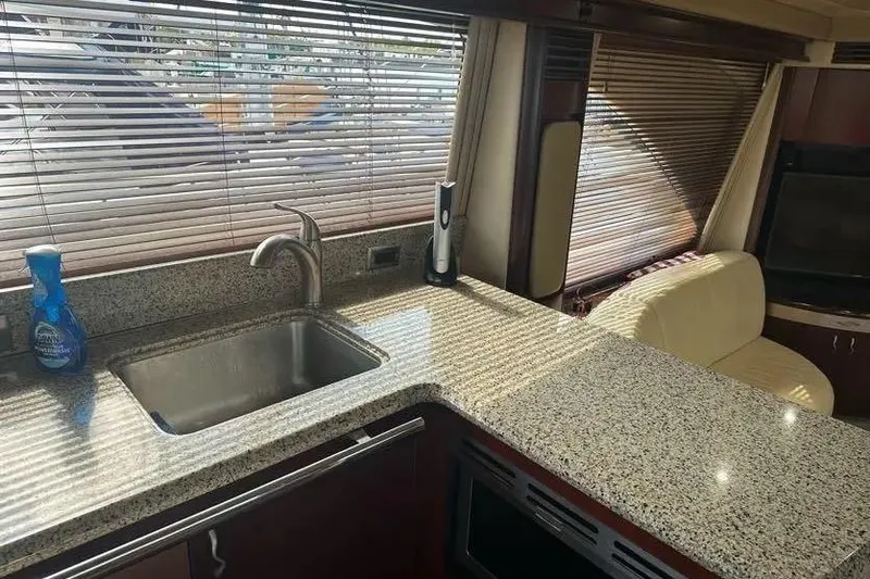  Yacht Photos Pics Luxurious 2006 Sea Ray 580 Sedan Bridge yacht interior with granite countertops and modern amenities.