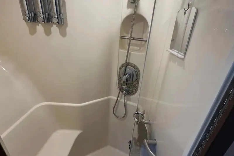  Yacht Photos Pics Shower area in 2006 Sea Ray 580 Sedan Bridge yacht, featuring modern fixtures.