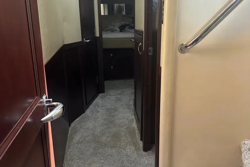  Yacht Photos Pics Interior hallway of 2006 Sea Ray 580 Sedan Bridge yacht with carpeted floor.