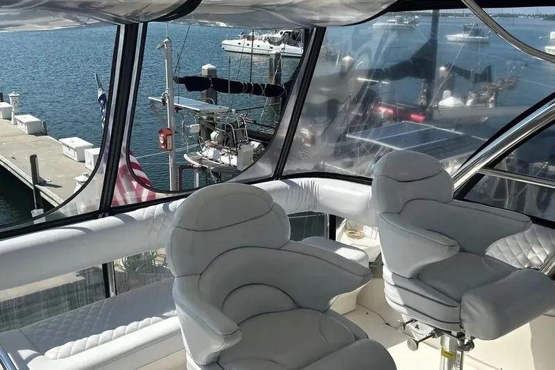  Yacht Photos Pics Luxurious interior of 2006 Sea Ray 580 Sedan Bridge yacht with marina view.