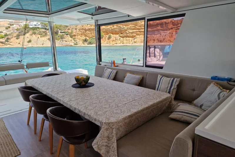 Only One Life Yacht Photos Pics Luxurious interior of 2022 Bali 5.4 Open Space yacht with ocean view and elegant dining area.