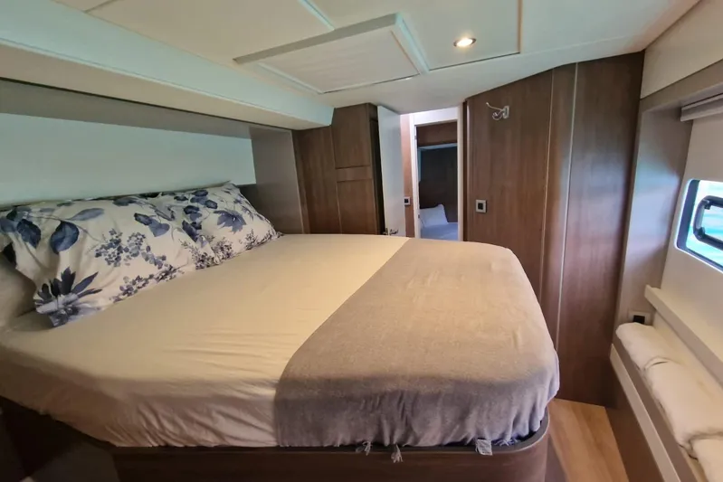 Only One Life Yacht Photos Pics Luxurious bedroom interior of 2022 Bali 5.4 Open Space yacht with cozy bedding.