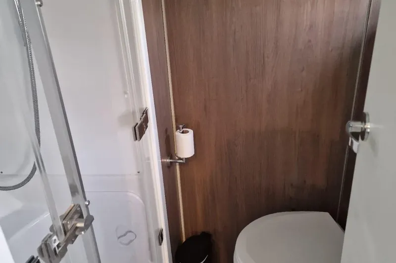 Only One Life Yacht Photos Pics Bathroom interior of 2022 Bali 5.4 Open Space yacht, featuring shower and toilet.