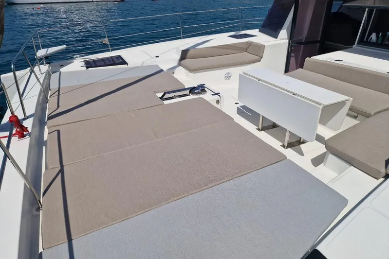 Only One Life Yacht Photos Pics Spacious deck of 2022 Bali 5.4 Open Space yacht with seating and table.