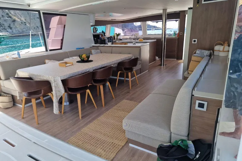 Only One Life Yacht Photos Pics Luxurious interior of 2022 Bali 5.4 Open Space catamaran with elegant dining area and modern design.