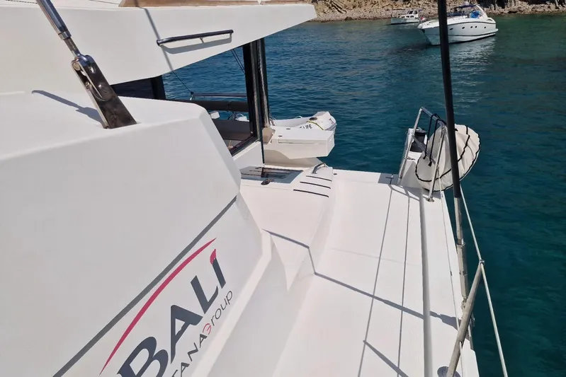 Only One Life Yacht Photos Pics Bali 5.4 Open Space 2022 yacht on clear blue water, showcasing sleek design.