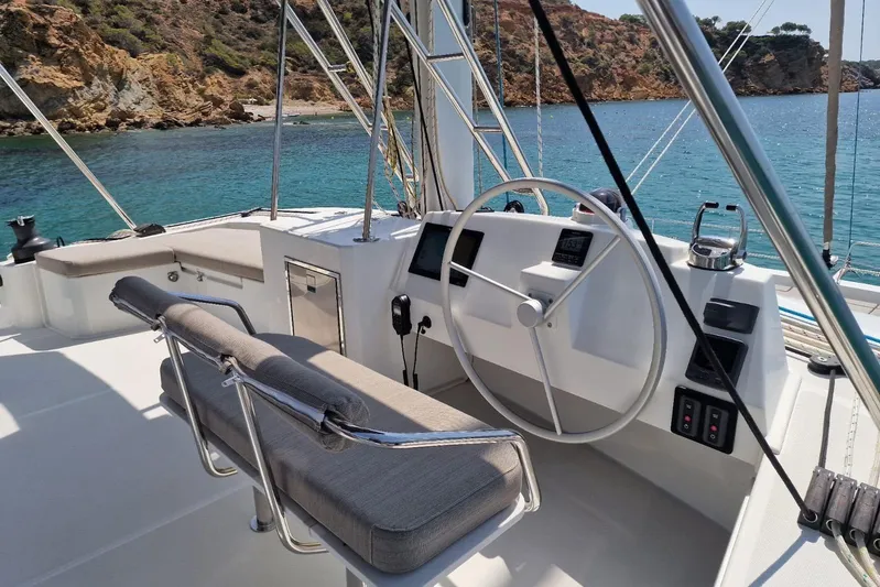 Only One Life Yacht Photos Pics 2022 Bali 5.4 Open Space yacht helm with scenic coastal view.