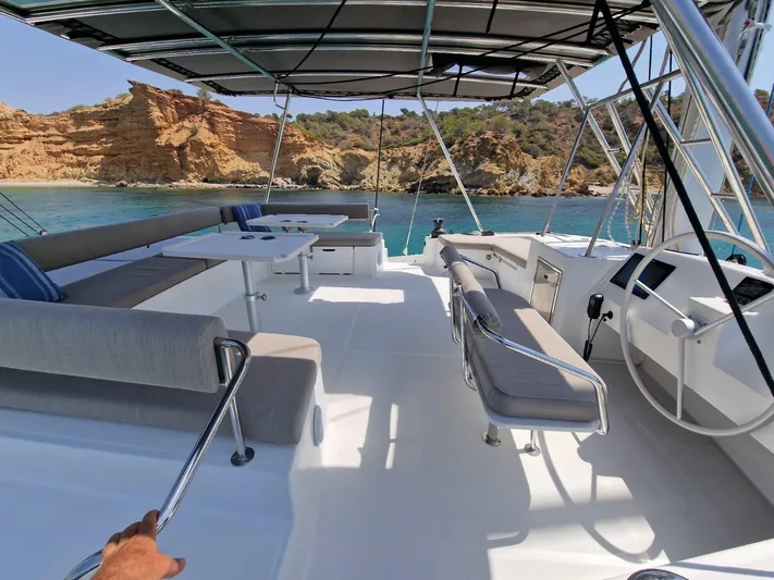 Only One Life Yacht Photos Pics Spacious deck of 2022 Bali 5.4 Open Space yacht with scenic coastal view.
