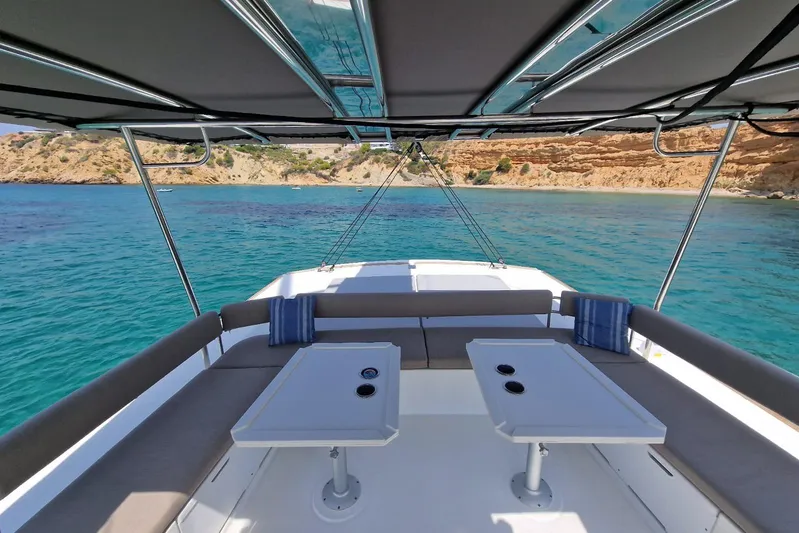 Only One Life Yacht Photos Pics 2022 Bali 5.4 Open Space yacht interior with ocean view and seating area.