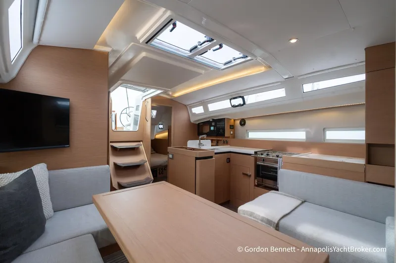 Shatzi Yacht Photos Pics Modern interior of 2022 Jeanneau Sun Odyssey 410 yacht with sleek design and natural lighting.