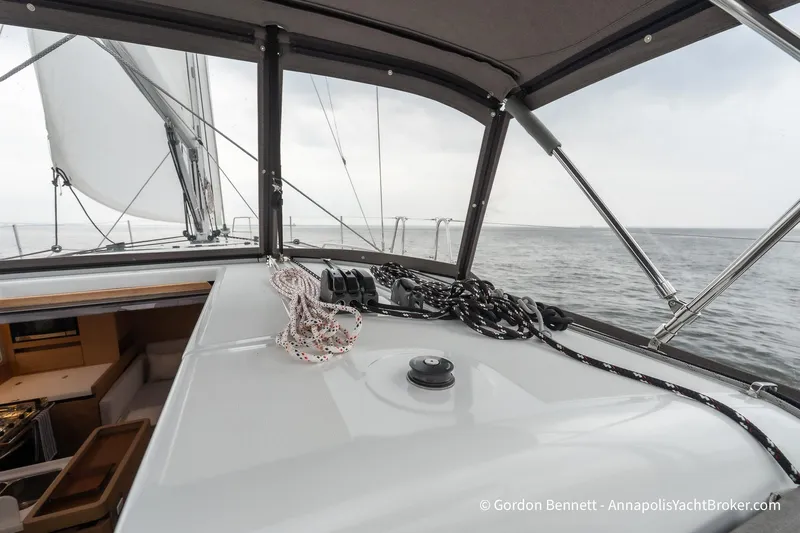 Shatzi Yacht Photos Pics Jeanneau Sun Odyssey 410 sailing yacht cockpit view, showcasing ropes and open sea.