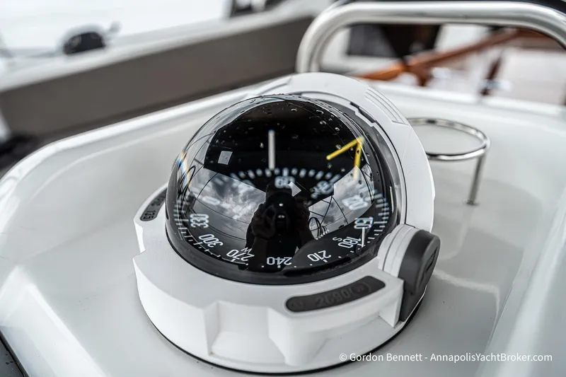 Shatzi Yacht Photos Pics Compass on Jeanneau Sun Odyssey 410 yacht, 2022 model, with reflective surface and detailed markings.