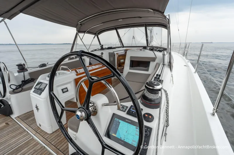 Shatzi Yacht Photos Pics 2022 Jeanneau Sun Odyssey 410 yacht cockpit with navigation equipment and steering wheel.