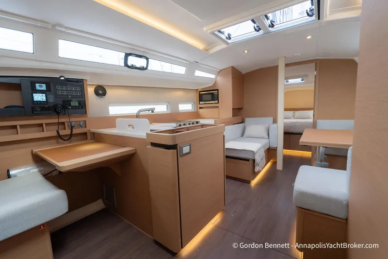 Shatzi Yacht Photos Pics Luxurious interior of 2022 Jeanneau Sun Odyssey 410 yacht with modern amenities and elegant design.