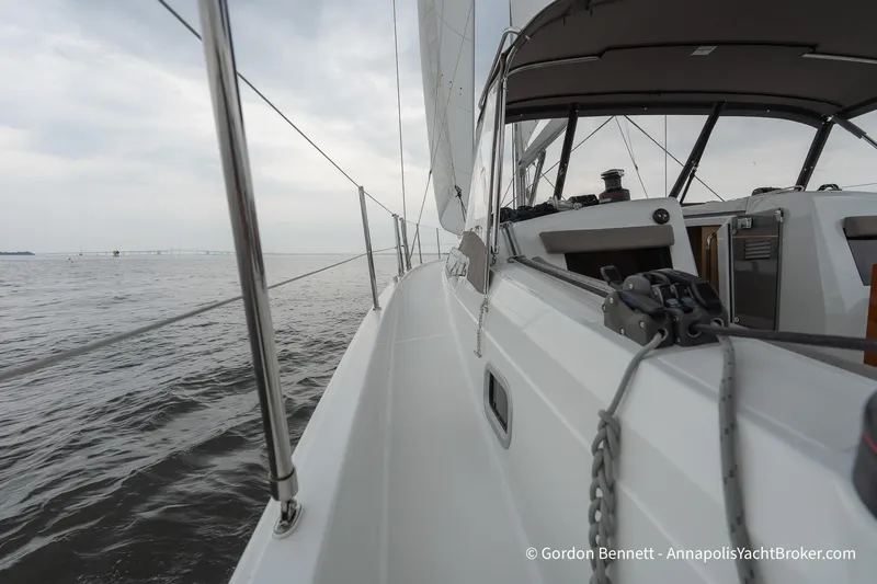 Shatzi Yacht Photos Pics Jeanneau Sun Odyssey 410 sailing on open water, 2022 model, side deck view.