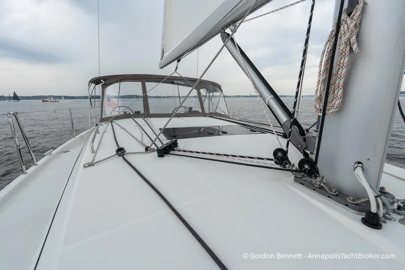 Shatzi Yacht Photos Pics 2022 Jeanneau Sun Odyssey 410 sailboat deck with rigging on calm waters.