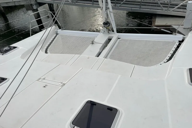  Yacht Photos Pics 2008 Seawind 1160 catamaran deck with netting, docked at marina.