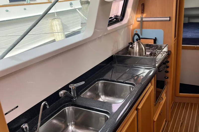  Yacht Photos Pics Galley kitchen in 2008 Seawind 1160 catamaran with dual sinks and stove.