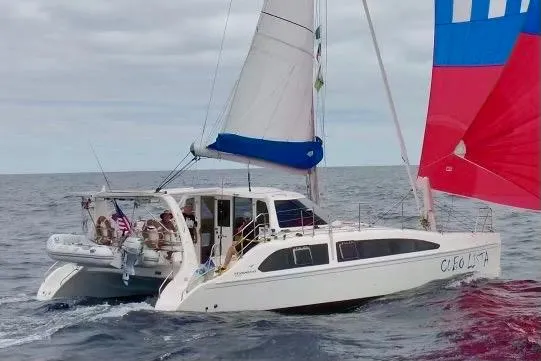  Yacht Photos Pics 2008 Seawind 1160 catamaran sailing on open ocean with vibrant sails.