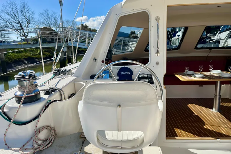  Yacht Photos Pics 2008 Seawind 1160 yacht interior with helm, dining area, and nautical equipment.