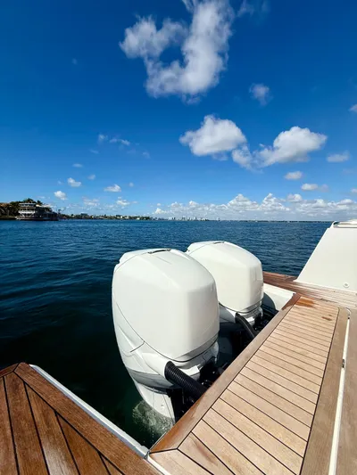  Yacht Photos Pics 2019 Fjord 36' Open boat with dual outboard engines on a sunny day.