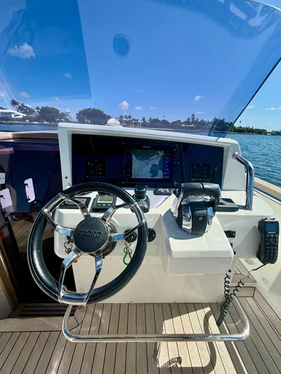  Yacht Photos Pics Helm of 2019 Fjord 36' Open boat with navigation equipment and steering wheel.