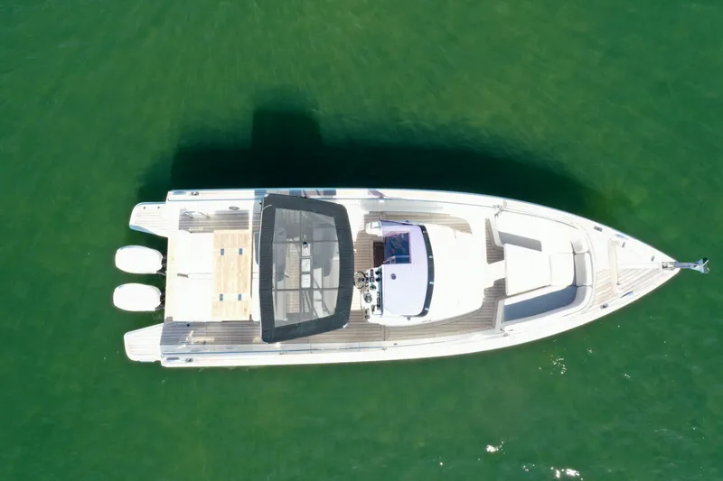  Yacht Photos Pics Aerial view of 2019 Fjord 36' Open boat on green water.