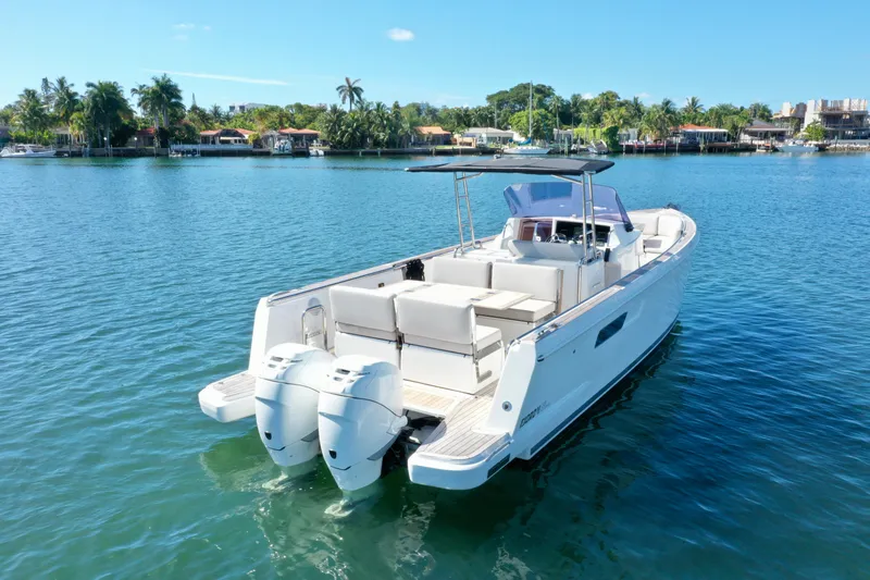  Yacht Photos Pics 2019 Fjord 36' Open boat on calm water, featuring dual outboard engines.
