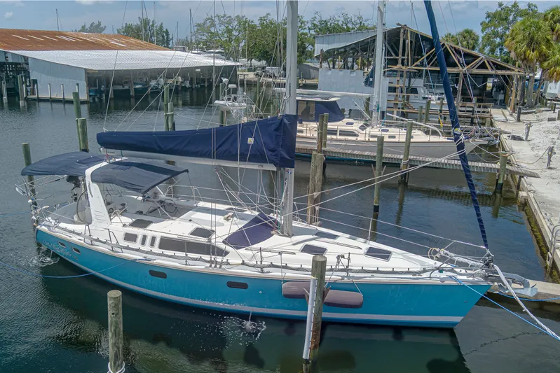 Into The Mystic Yacht Photos Pics Hunter 430 sailboat, 1996 model, docked at a marina with blue hull and white deck.