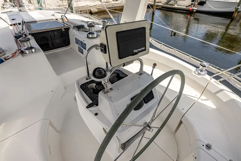 Into The Mystic Yacht Photos Pics Cockpit of 1996 Hunter 430 sailboat with steering wheel and navigation equipment.