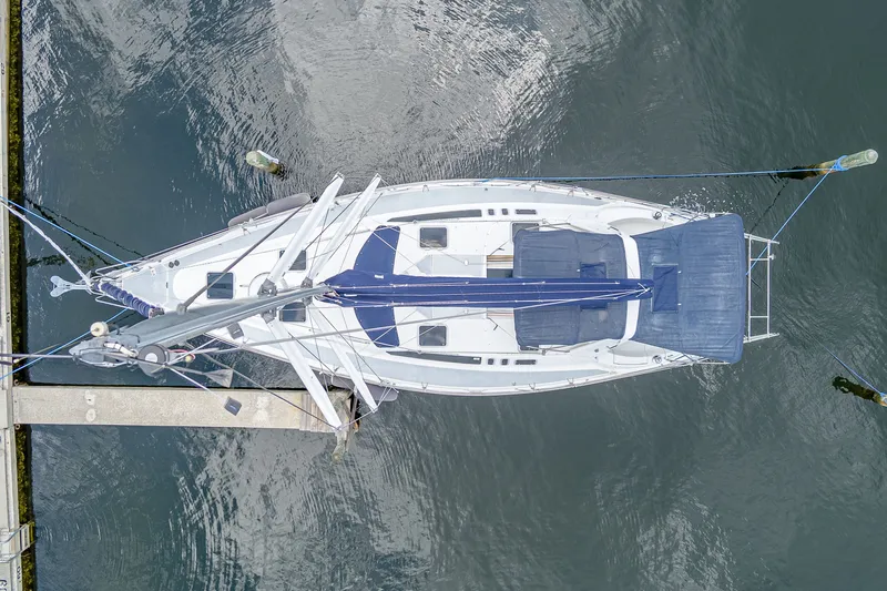 Into The Mystic Yacht Photos Pics Overhead view of a 1996 Hunter 430 sailboat docked in calm waters.