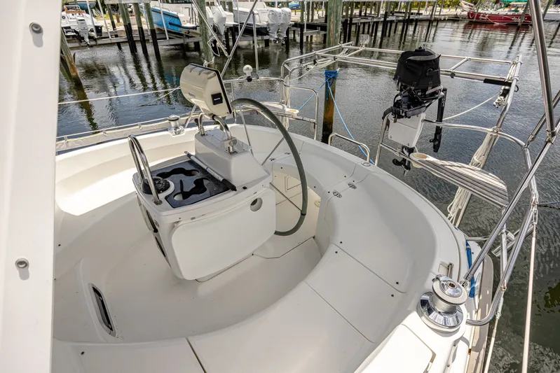 Into The Mystic Yacht Photos Pics Cockpit of a 1996 Hunter 430 sailboat, featuring steering wheel and navigation equipment.