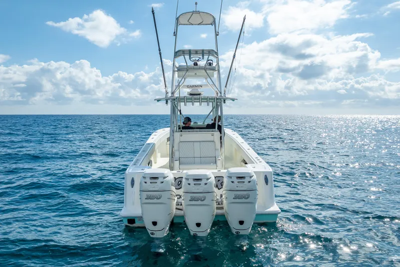  Yacht Photos Pics 2017 SeaVee 370Z boat with triple engines on open ocean under blue sky.