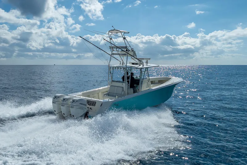  Yacht Photos Pics 2017 SeaVee 370Z boat cruising on open ocean under a clear blue sky.