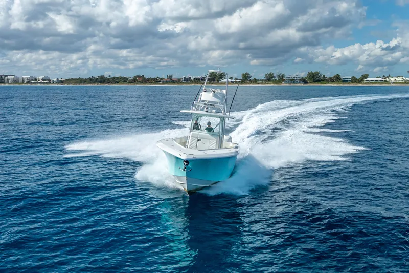  Yacht Photos Pics 2017 SeaVee 370Z boat cruising on open blue water under cloudy sky.