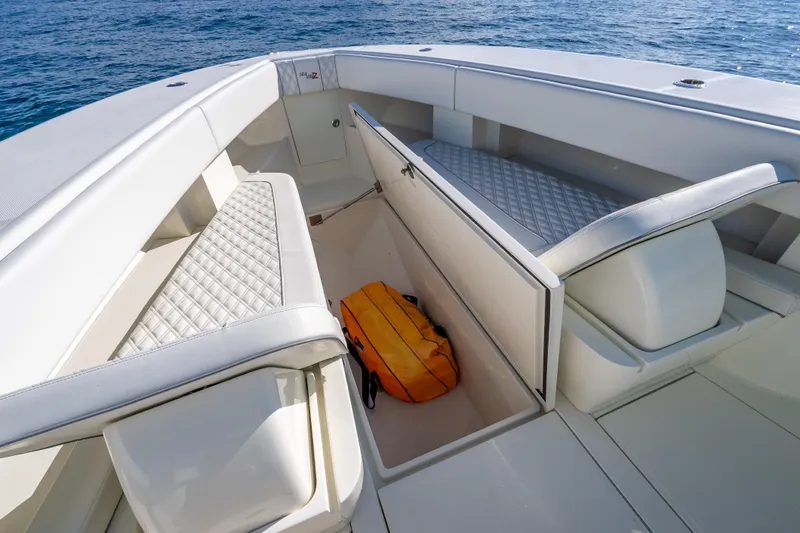  Yacht Photos Pics 2017 SeaVee 370Z boat interior with open storage compartment and cushioned seating.