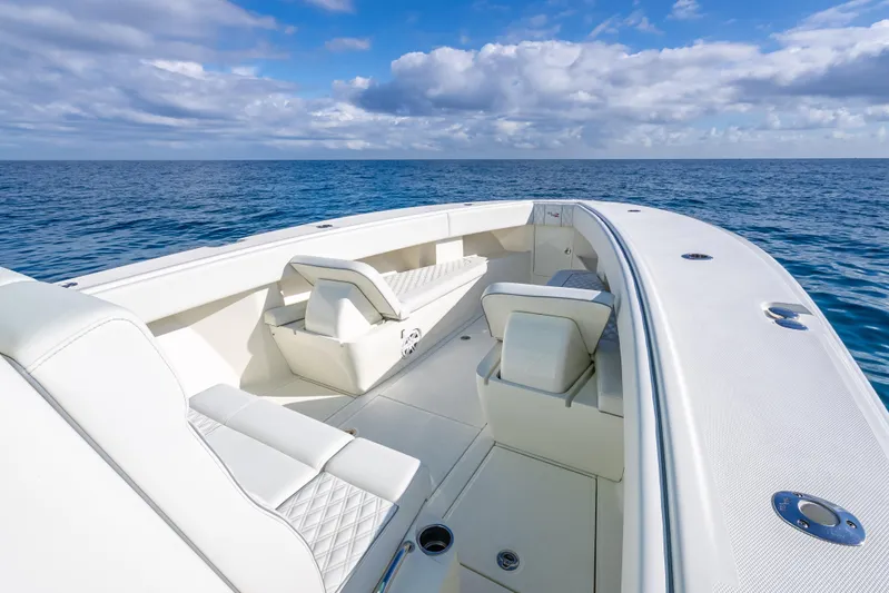  Yacht Photos Pics 2017 SeaVee 370Z boat with white seating, cruising on open ocean under blue sky.