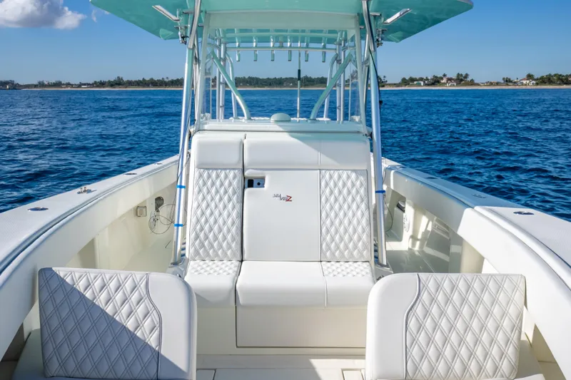  Yacht Photos Pics 2017 SeaVee 370Z boat interior with white seating, ocean view, and clear sky.