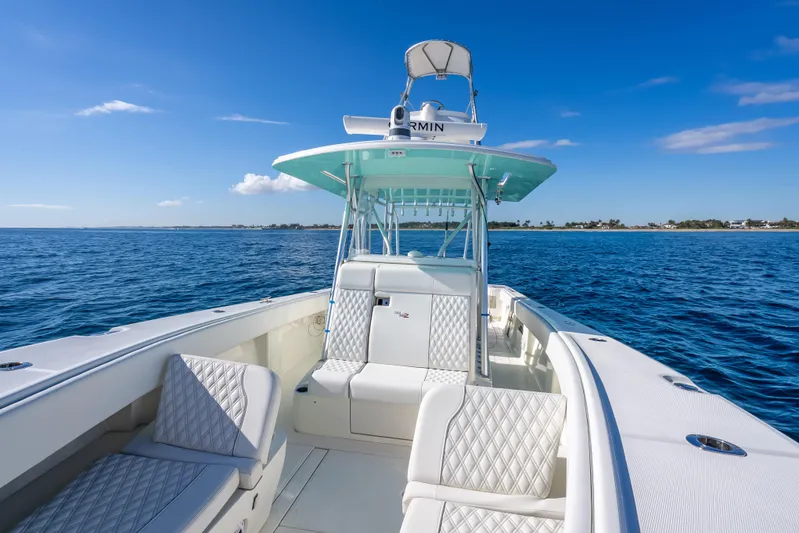  Yacht Photos Pics 2017 SeaVee 370Z boat on open water, featuring sleek design and luxurious seating.