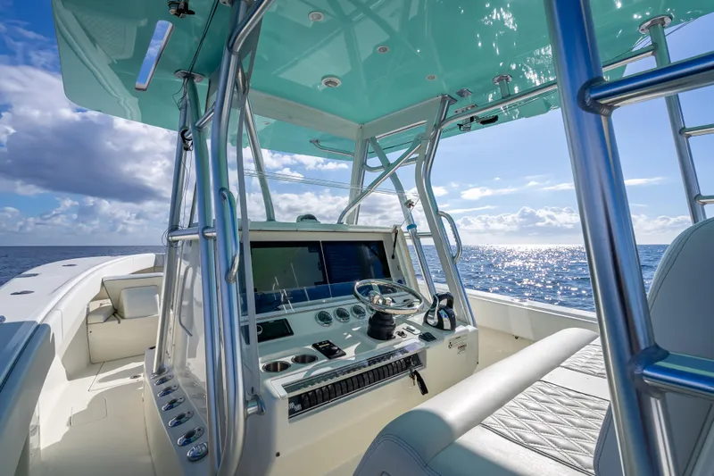  Yacht Photos Pics 2017 SeaVee 370Z boat interior with helm, ocean view, and clear sky.